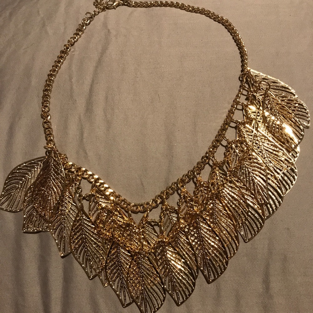 Gold colored feather necklace